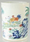 A CHINESE DOUCAI PORCELAIN BRUSH POT, painted with chickens, character mark to base, 16cm high.