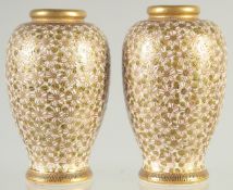 A SMALL PAIR OF JAPANESE SATSUMA VASES, with fine floral decoration and gilt highlights, the bases
