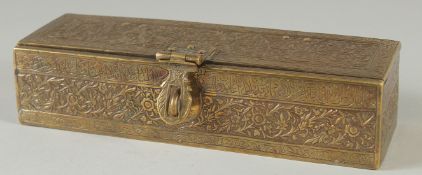 A FINE INDO PERSIAN ENGRAVED BRASS PEN BOX, signed and dated under front hinge, 25cm x 7.5cm.