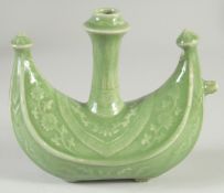A CHINESE OTTOMAN MARKET GREEN GLAZE WATER POT, with floral decoration, 19cm long.