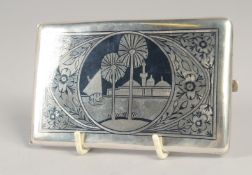 AN IRAQI SILVER NIELLO CIGARETTE CASE, inscribed to reverse, 8cm x 12.5cm.