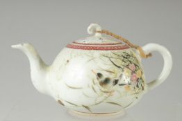 A CHINESE REPUBLIC POLYCHROME PORCELAIN TEAPOT, 18cm spout to handle.