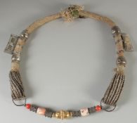 AN ISLAMIC SILVER, GILT METAL AND HARDSTONE MARRIAGE NECKLACE.