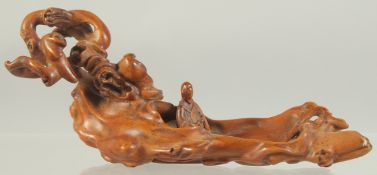 A VERY FINE CHINESE BOXWOOD CARVING, depicting a miniature naturalistic scene with a seated