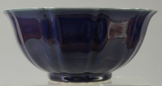 A CHINESE SACRIFICIAL BLUE PETAL FORM BOWL, 23cm wide.
