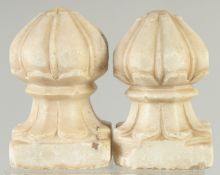 TWO FINE 19TH CENTURY MUGHAL INDIAN CARVED WHITE MARBLE CARPET WEIGHTS, 16cm high.