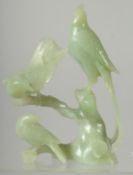 A CHINESE CARVED JADE BIRD GROUP on hardwood stand, 21cm high overall.