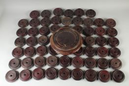 A LARGE QUANTITY OF CHINESE HARDWOOD STANDS, (qty).