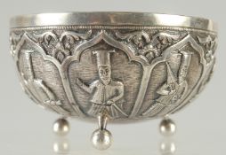 A RARE INDIAN PARSI SILVER BOWL, with embossed and engraved figures and raised on three ball feet,