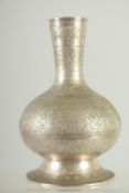 A SMALL ISLAMIC ENGRAVED WHITE METAL VASE, 17.5cm high.