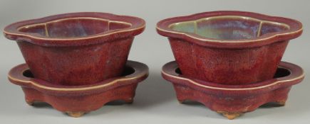 A PAIR OF CHINESE JUN WARE POTTERY PLANT POTS AND STANDS, (4 pieces).