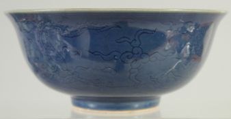 A CHINESE BLUE GLAZE PORCELAIN BOWL, with incised dragons, the base with six-character mark, 16cm