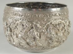 A FINE LARGE 19TH CENTURY BURMESE SILVER BOWL, with repousse decoration, 22cm diameter. weight 900g.