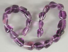AN AMETHYST BEADED NECKLACE.