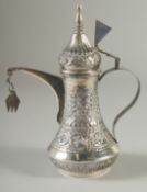 A GOOD SMALL ISLAMIC SILVER EWER, with hinged cover and strapwork handle, curving spout, body and