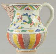 A TURKISH OTTOMAN KUTAHYA GLAZE POTTERY WATER JUG, 11.5cm high.