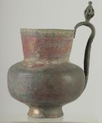 A RARE 10TH-11TH CENTURY PERSIAN GHAZNAVID HIGH TIN BRONZE JUG, engraved with animals, 22.5cm high.