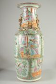 A LARGE CHINESE CANTON FAMILLE ROSE PORCELAIN VASE, the neck with moulded chilong, painted with