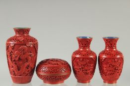 A COLLECTION OF FOUR CHINESE CINNABAR LACQUER ITEMS; comprising a pair of vases, a single vase,