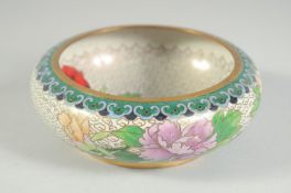 A CHINESE CLOISONNE BOWL, decorated with flora, 13cm diameter.