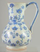 A TURKISH OTTOMAN KUTAHYA GLAZED POTTERY WATER JUG, 22.5cm.