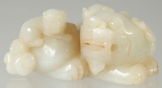 A CHINESE CARVED JADE 'THREE LION' PAPERWEIGHT, 11cm wide.