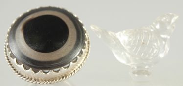 AN ISLAMIC GLASS BIRD, together with a large ring (2).