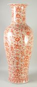 A LARGE DECORATIVE CHINESE IRON RED AND WHITE PORCELAIN FLOOR-STANDING VASE, painted with flora,