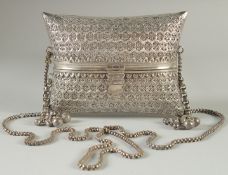 A FINE ISLAMIC SILVER PURSE, with finely pierced and engraved decoration, 15cm wide, weight 580g.