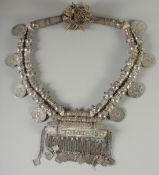 A LARGE ISLAMIC SILVER AND GILT METAL MARRIAGE NECKLACE, with attached coins dated 1780.