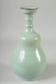 AN UNUSUAL CHINESE CELADON GLAZE VASE, 28cm high.