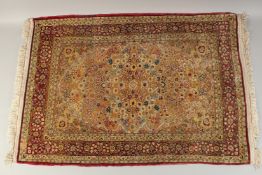 A SILK AND METAL THREADED HEREKE RUG, 101cm x 69cm.