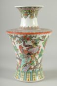 A LARGE CHINESE TRI-COLOUR PORCELAIN VASE, painted with exotic birds and flowers, red character mark