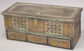 A MOORISH COFFER, with brass studded decoration, rising top, and candle box to the interior, the