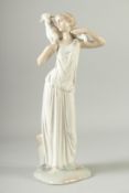 A NAO PORCELAIN FIGURE OF A YOUNG GIRL CARRYING A LAMB. 14.5ins high.
