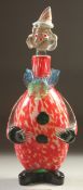 A MURANO SPECKLED GLASS CLOWN BOTTLE, the head as a stopper. a/f 12ins high.