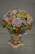 A STEVENS AND HANCOCK DERBY FLOWER ENCRUSTED URN.