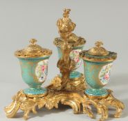 A VERY GOOD SEVRES PORCELAIN THREE BOTTLE INKSTAND, the Sevres bottles painted with flowers with a