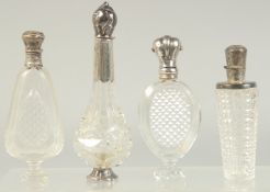 FOUR GOOD 19TH CENTURY FRENCH SILVER MOUNTED GLASS SCENT BOTTLES.