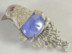 A GOOD CARBOUCHON TANZANITE AND DIAMOND BIRD BROOCH.