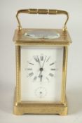 A GOOD 19TH CENTURY FRENCH ENGRAVED BRASS CARRIAGE CLOCK, repeater with alarm, in a leather carrying