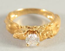 A GOOD 18CT GOLD SINGLE STONE DIAMOND FIGURAL RING.