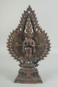 A BRONZE MULTI ARM DEITY. 16ins high.