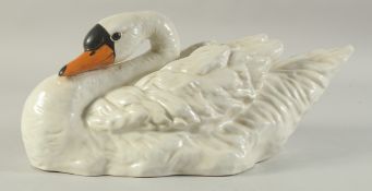A LARGE SEVRES DESIGN WHITE PORCELAIN SWAN. 16ins long.