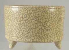 A CHINESE CRACKLE GLAZE TRIPOD CENSER. 11.5cm diameter.