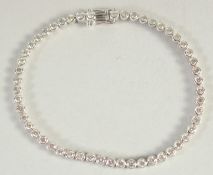 AN 18CT WHITE GOLD AND DIAMOND LINE BRACELET, diamonds approx. 3 carats.