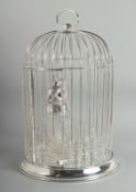 A GOOD SILVER PLATED BIRD CAGE with bird decanter and eight glasses. 18ins high.