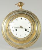 AN FRENCH BRASS CIRCULAR SEDAN CLOCK with enamel dial, with replacement battery works.