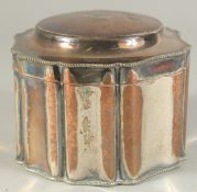 A SILVER PLATED TEA CADDY AND COVER, with engraved crest.