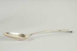A GEORGE IV FSILVER FIDDLE PATTERN GRAVY SPOON. London 1829. Maker W. T.